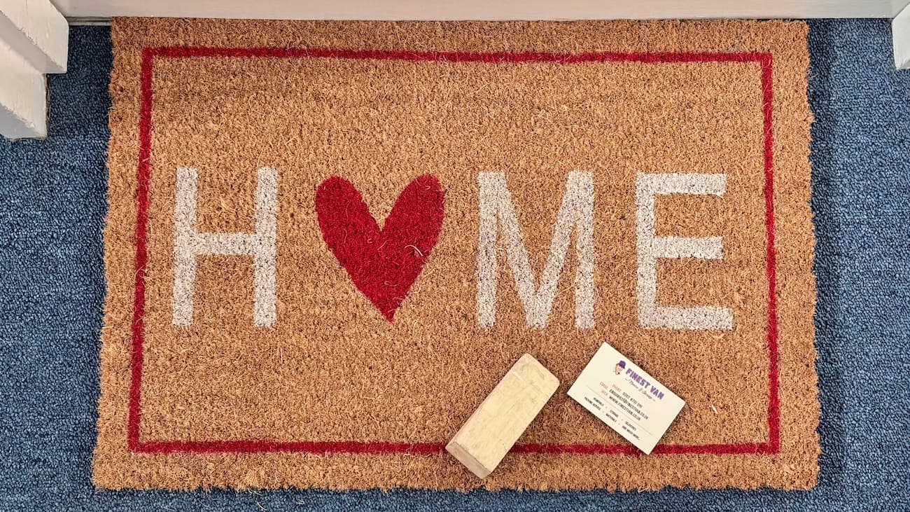 Finest Van business card on a home doormat after a student move in London