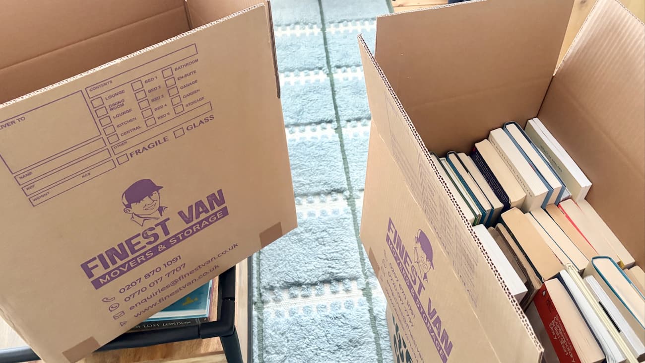 Two storage boxes with books and student belongings ready for student storage in London