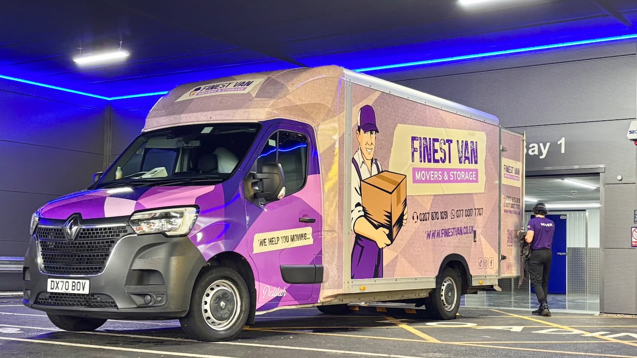 Finest Van removals specialist closing the van after unloading items into student storage at a London storage facility