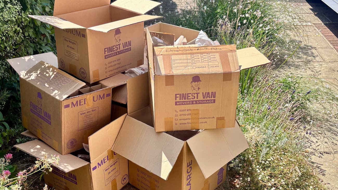 Mix of used cardboard moving boxes after being unpacked following a house move
