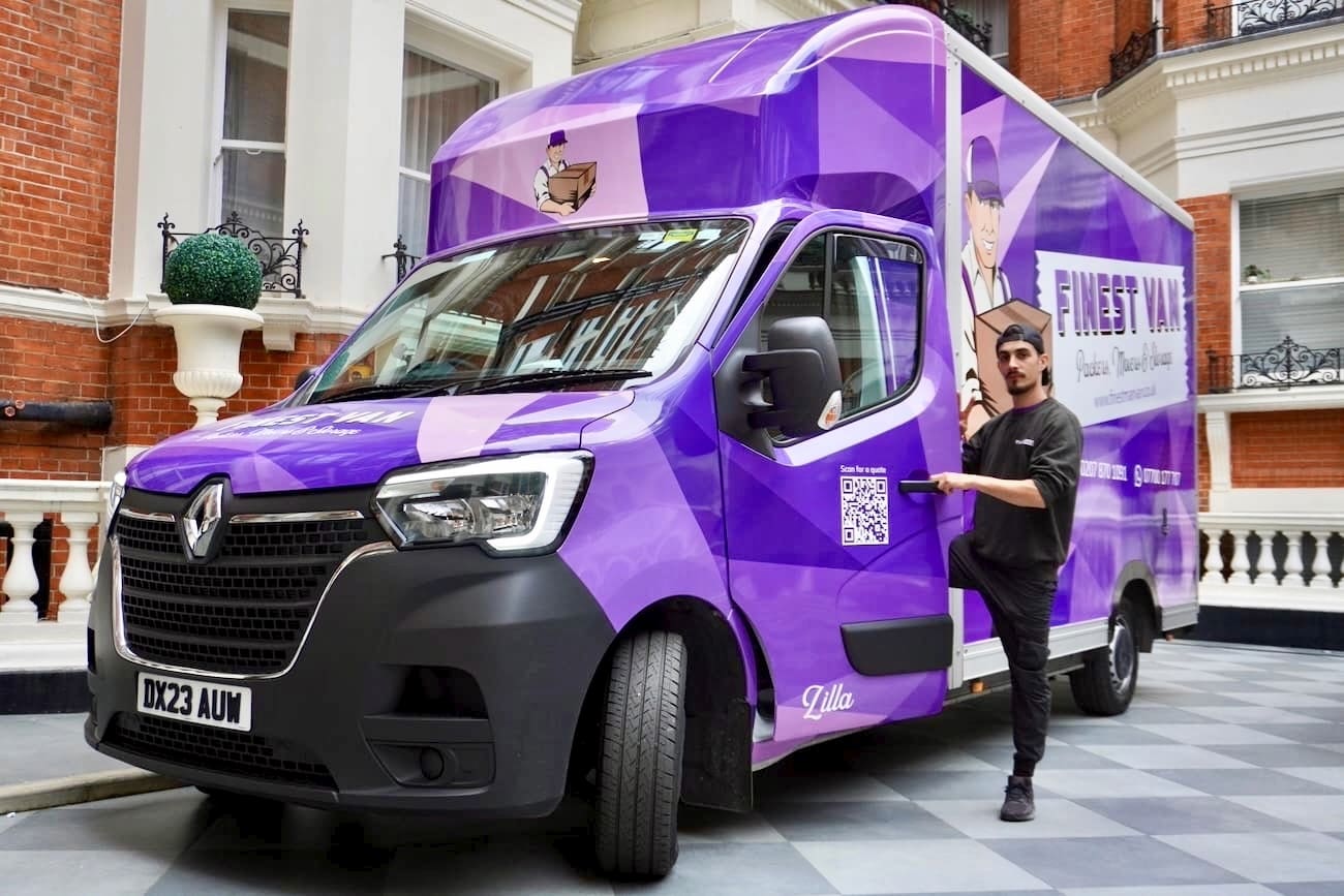 Finest Van removals specialist on moving day Finest Van removals specialist beside a removal van during a London house move