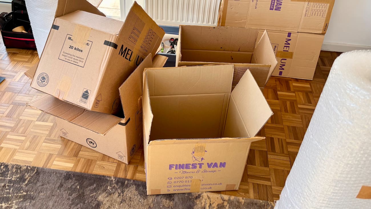 Open moving boxes ready to be packed before a Balham move